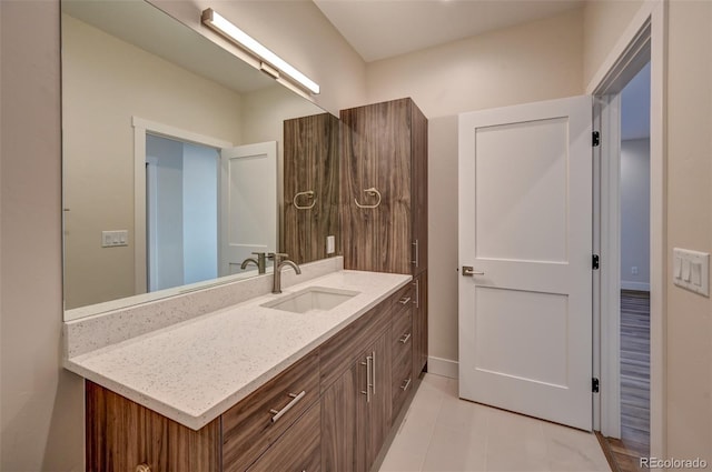 bathroom featuring tile patterned floors and vanity