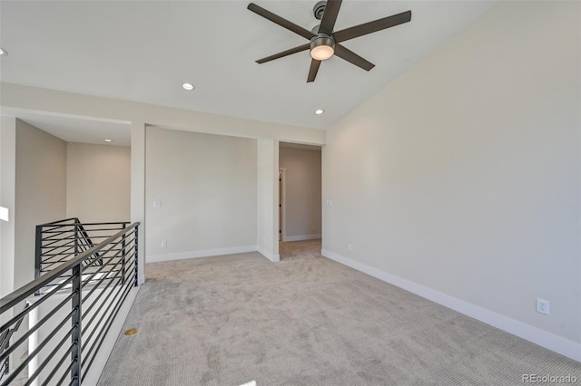 unfurnished room featuring ceiling fan and light colored carpet