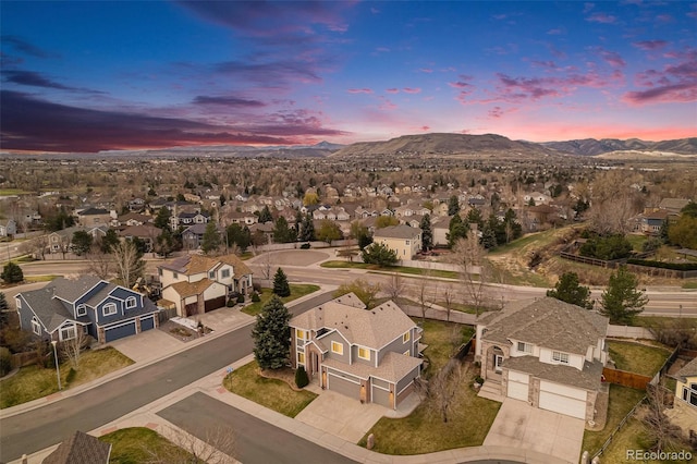 birds eye view of property with a mountain view and a residential view