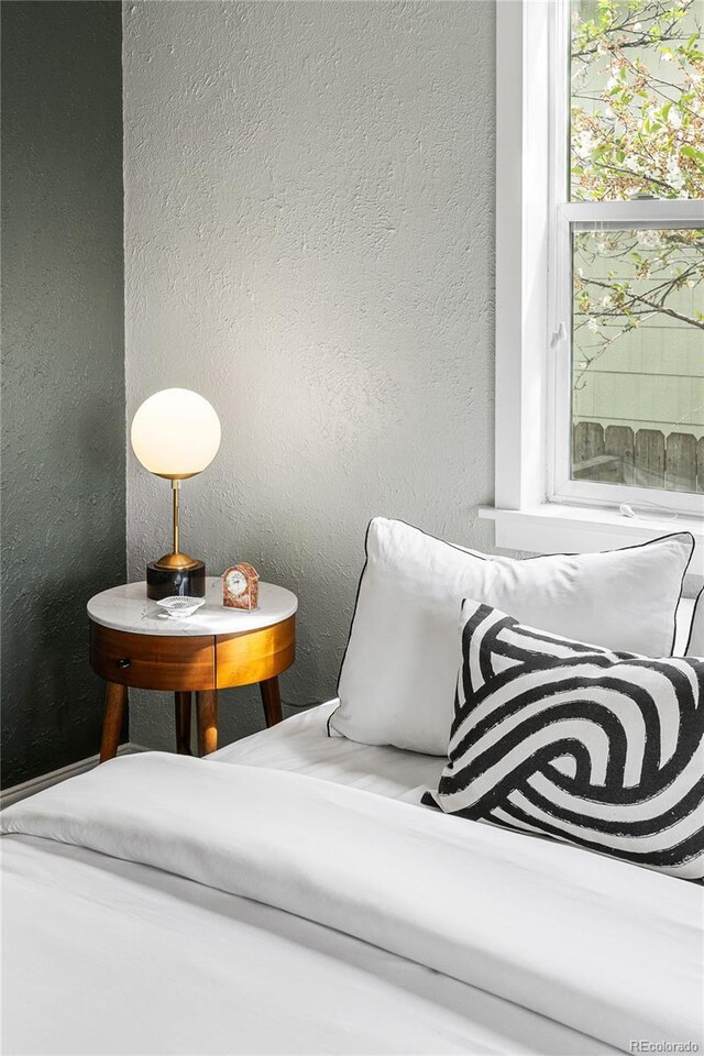 living area with a textured wall
