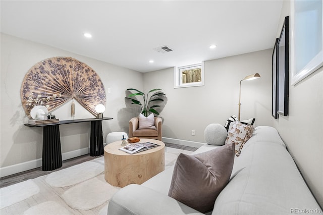 interior space with recessed lighting, baseboards, visible vents, and wood finished floors
