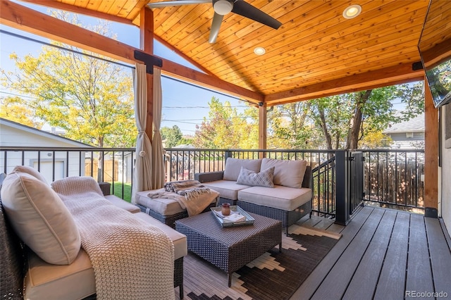 deck featuring outdoor lounge area and a ceiling fan