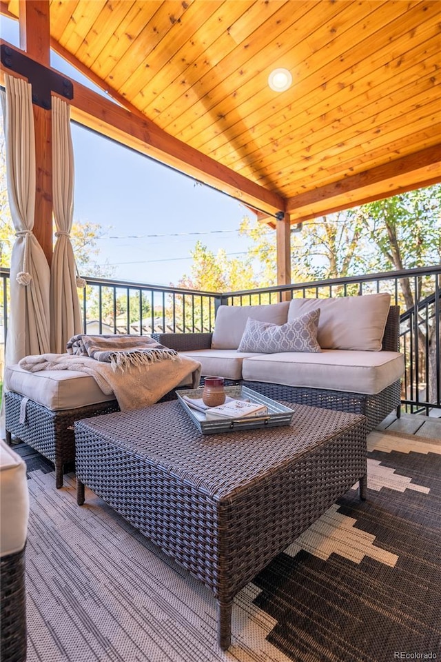wooden terrace with outdoor lounge area