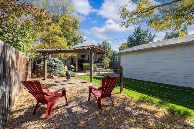 view of yard with fence and a patio