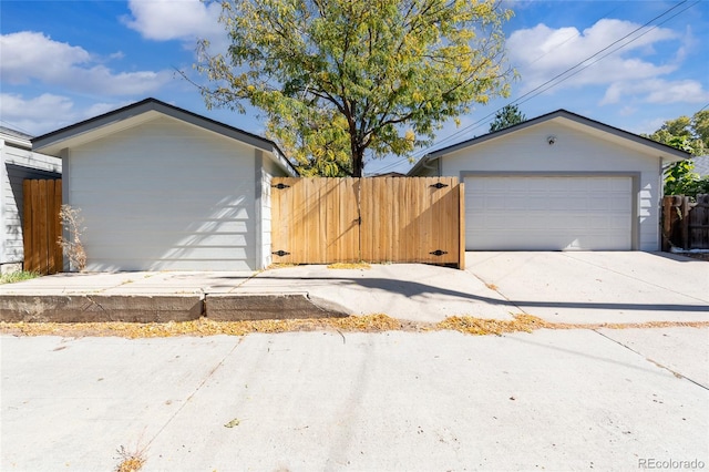 garage with fence and a gate
