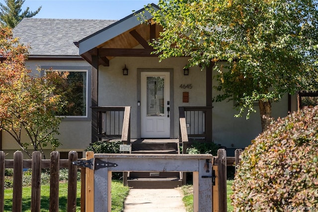 4645 Quitman St, Denver, CO 80212 - entrance to property featuring stucco siding and roof with shingles