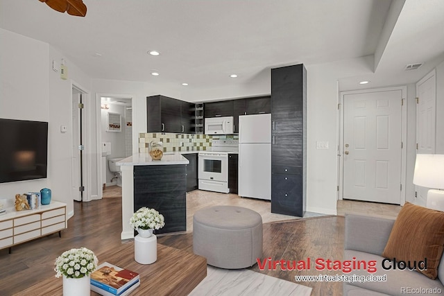 5250 S Huron Way Unit 3-205, Littleton, CO 80120 - living area featuring recessed lighting, light wood finished floors, and baseboards