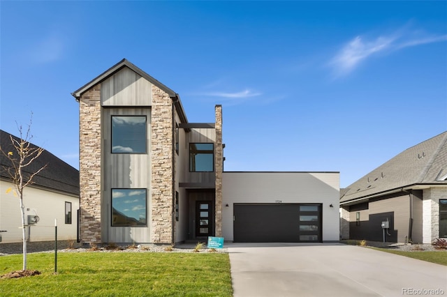 1724 Barefoot Dr, Windsor, CO 80550 - contemporary home with stone siding, a garage, concrete driveway, a front lawn, and board and batten siding