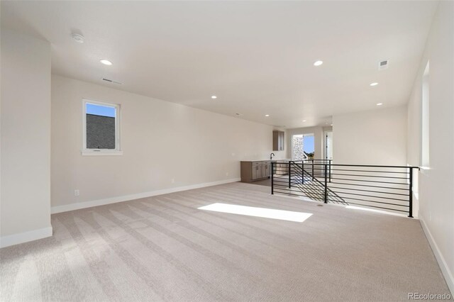 1724 Barefoot Dr, Windsor, CO 80550 - empty room featuring light carpet, baseboards, recessed lighting, and a smoke detector