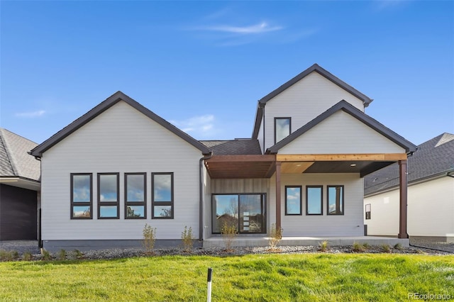 1724 Barefoot Dr, Windsor, CO 80550 - back of house featuring a yard