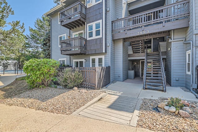 exterior space with stairs and fence