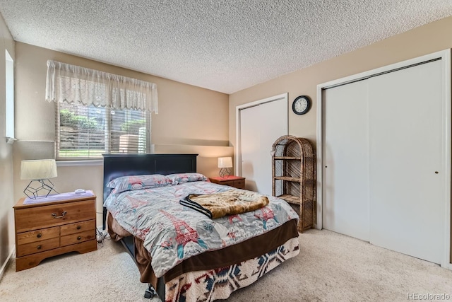 carpeted bedroom featuring a closet and a textured ceiling