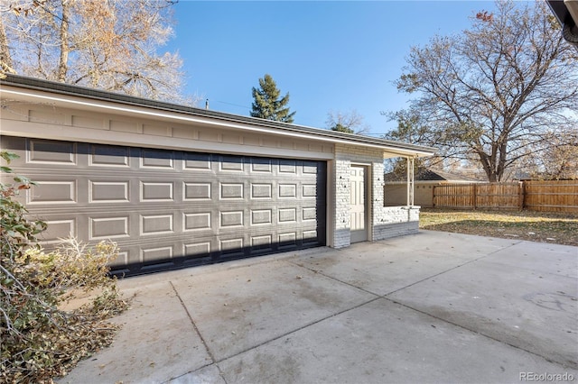 garage with fence