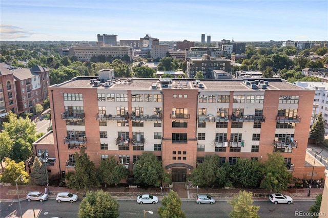 birds eye view of property with a view of city