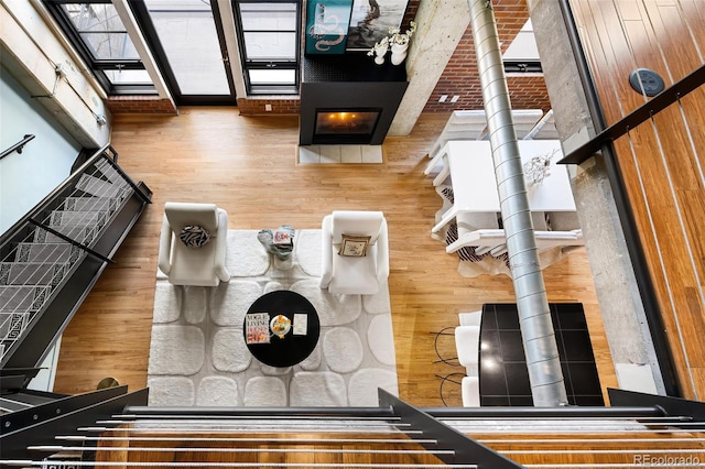 interior space with a skylight and wood finished floors