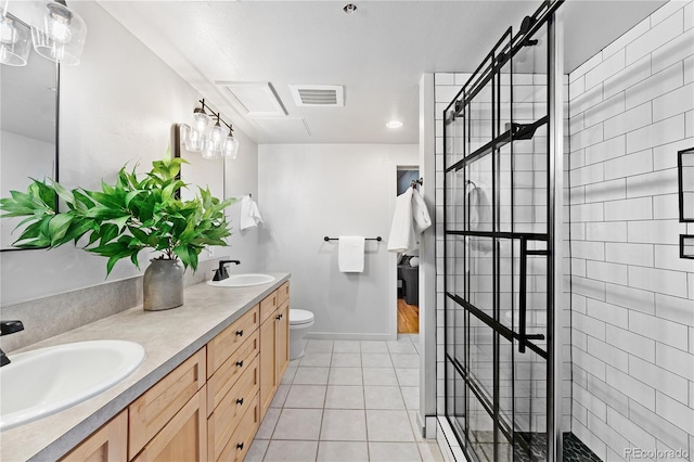 bathroom featuring visible vents, a sink, a tile shower, and tile patterned floors