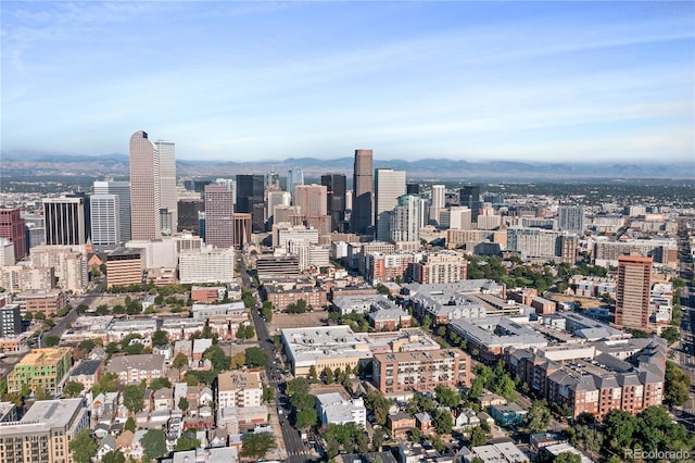 property's view of city featuring a mountain view