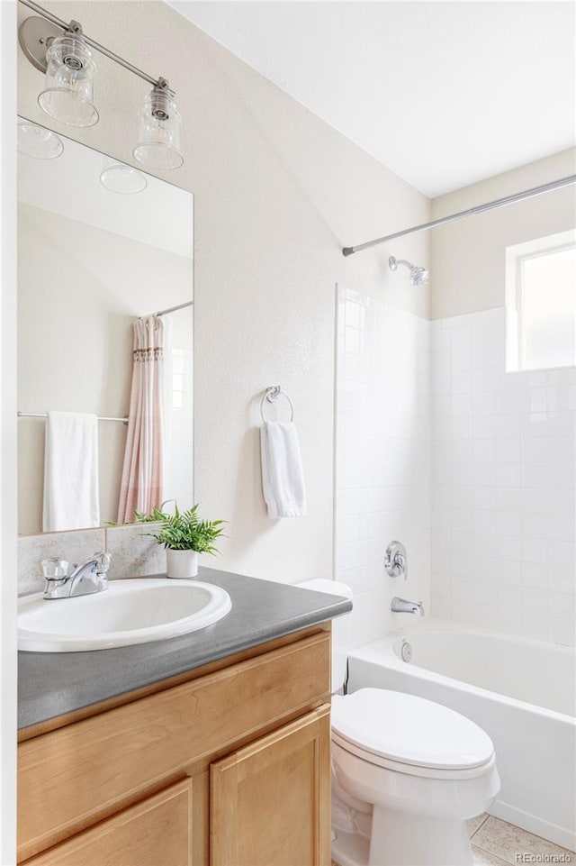 full bathroom featuring vanity, toilet, and shower / tub combo with curtain