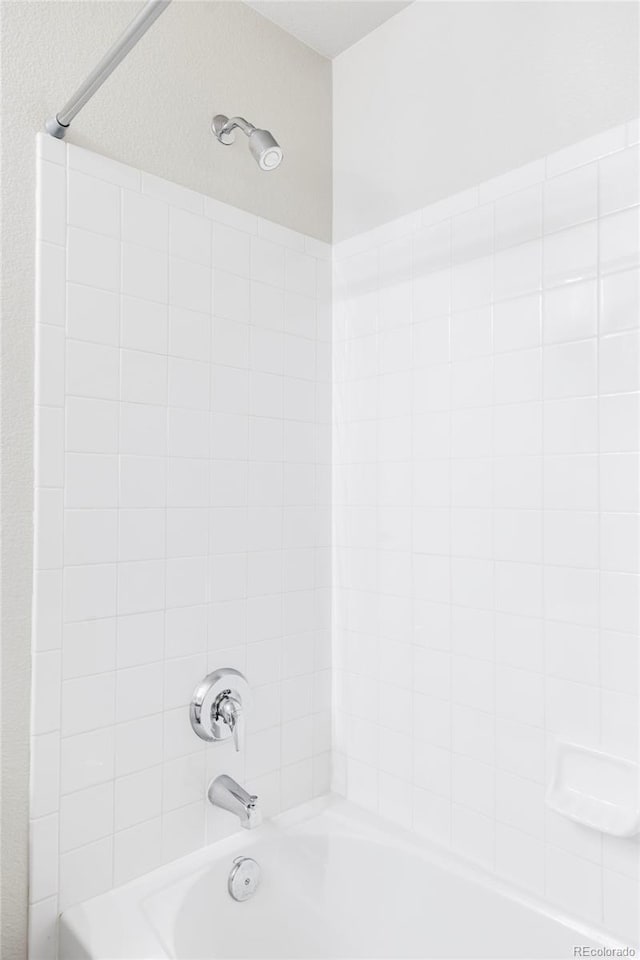 bathroom with tub / shower combination