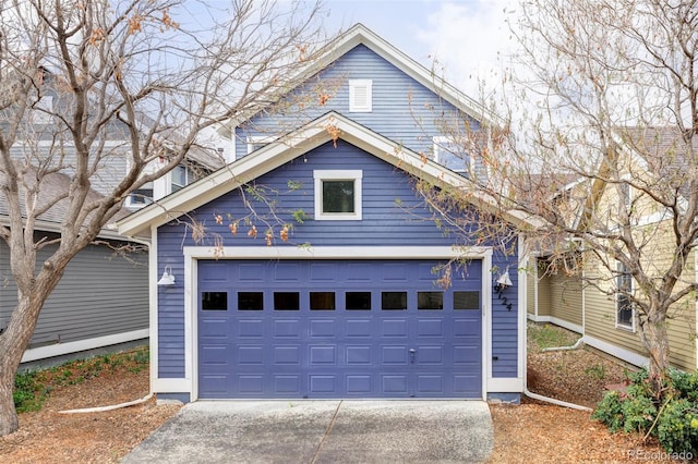 garage featuring driveway