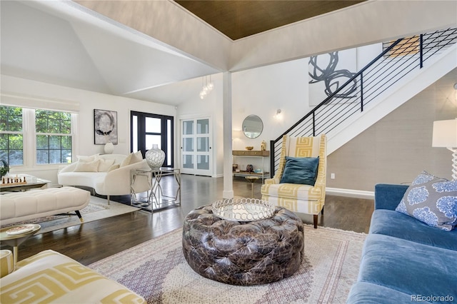 11389 E Maplewood Ave, Englewood, CO 80111 - living room with stairs, wood finished floors, and a towering ceiling