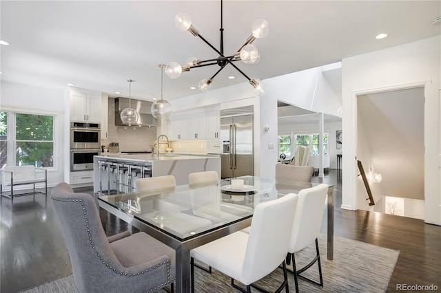 11389 E Maplewood Ave, Englewood, CO 80111 - dining space featuring dark wood-style floors, a chandelier, and recessed lighting
