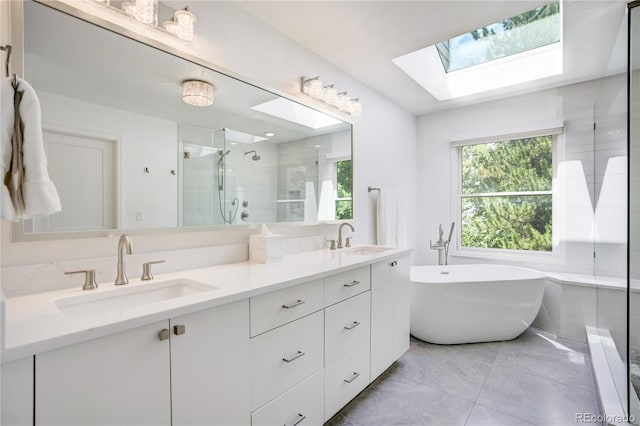 11389 E Maplewood Ave, Englewood, CO 80111 - bathroom with a skylight, a shower stall, double vanity, and a soaking tub