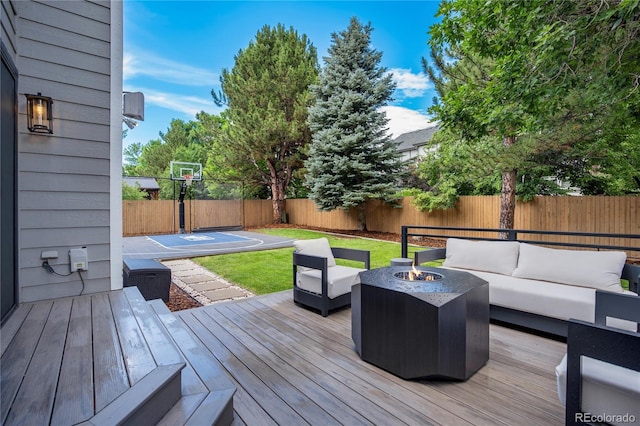 11389 E Maplewood Ave, Englewood, CO 80111 - wooden deck featuring an outdoor living space with a fire pit and a fenced backyard