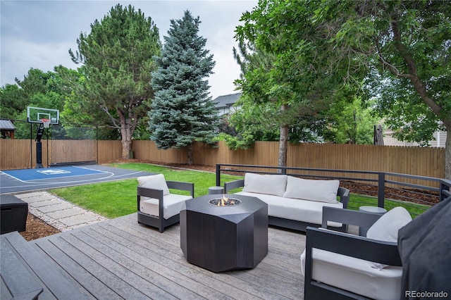 11389 E Maplewood Ave, Englewood, CO 80111 - wooden deck featuring an outdoor living space with a fire pit and a fenced backyard