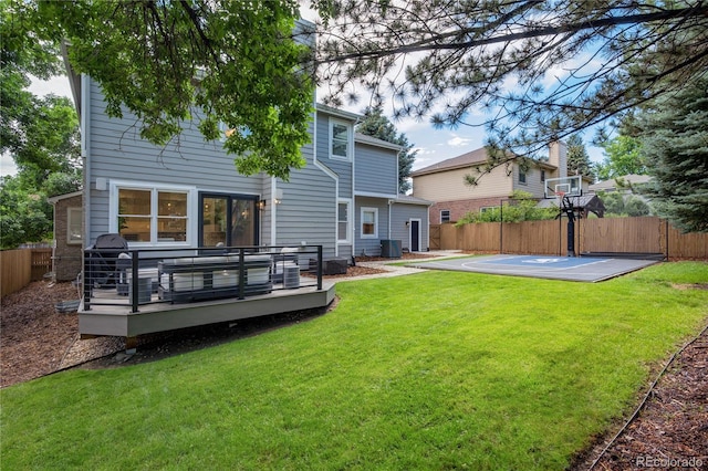 11389 E Maplewood Ave, Englewood, CO 80111 - rear view of property with a fenced backyard, a wooden deck, and basketball hoop
