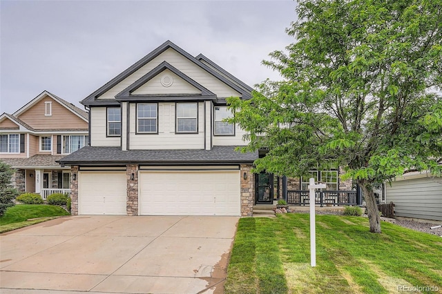 22367 Quail Run Dr, Parker, CO 80138 - view of front of home featuring a garage, concrete driveway, a front lawn, and roof with shingles