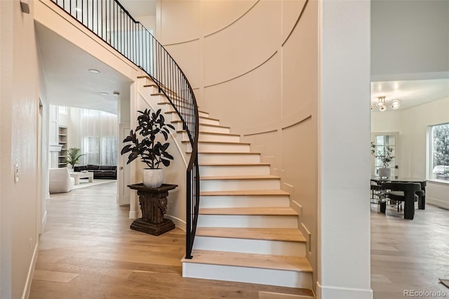 22367 Quail Run Dr, Parker, CO 80138 - stairway with a towering ceiling and wood finished floors