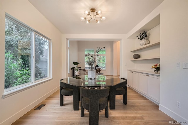 22367 Quail Run Dr, Parker, CO 80138 - dining area featuring a chandelier and light wood-style flooring
