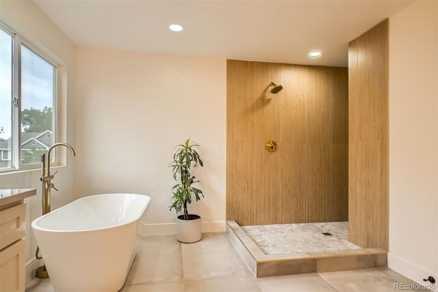 22367 Quail Run Dr, Parker, CO 80138 - full bathroom with a tile shower, a soaking tub, recessed lighting, vanity, and tile patterned floors