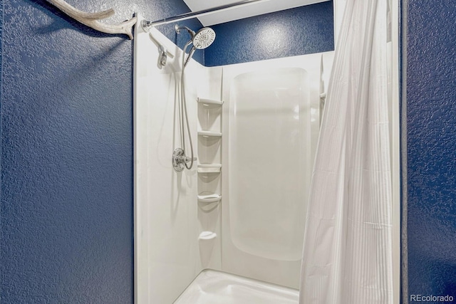 bathroom featuring a shower with curtain