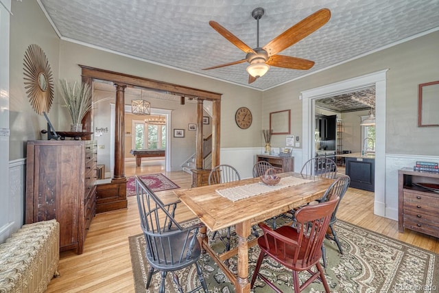 403 Scott St, Salida, CO 81201 - dining space with plenty of natural light, a wainscoted wall, light wood-type flooring, crown molding, and ceiling fan