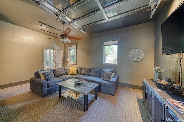 403 Scott St, Salida, CO 81201 - living room featuring light carpet, rail lighting, baseboards, and a ceiling fan