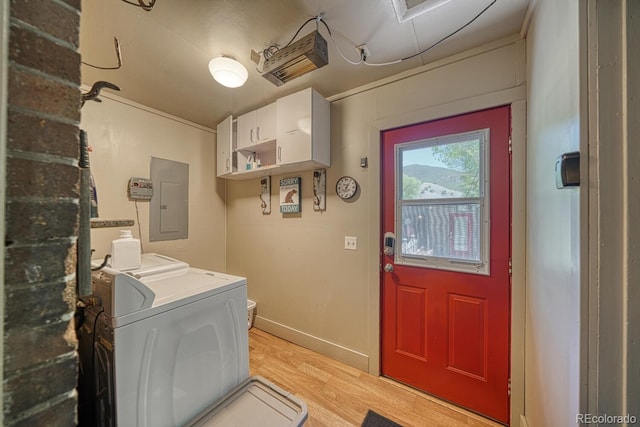 403 Scott St, Salida, CO 81201 - washroom featuring separate washer and dryer, electric panel, light wood-style flooring, and baseboards