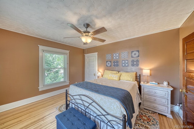 403 Scott St, Salida, CO 81201 - bedroom featuring light wood finished floors, ceiling fan, ornamental molding, and baseboards