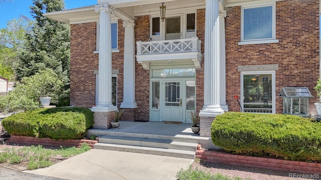 403 Scott St, Salida, CO 81201 - view of exterior entry featuring covered porch and brick siding