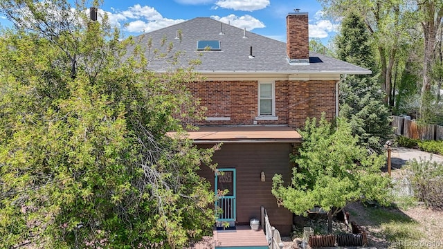 403 Scott St, Salida, CO 81201 - back of property with a chimney, a wooden deck, roof with shingles, and brick siding