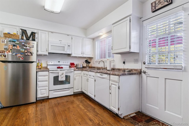 kitchen featuring white appliances, white cabinetry, sink, and dark hardwood / wood-style floors