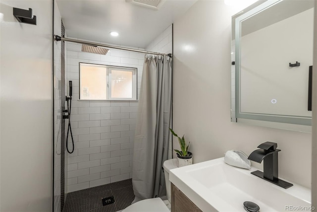 bathroom with vanity, toilet, and a shower with shower curtain