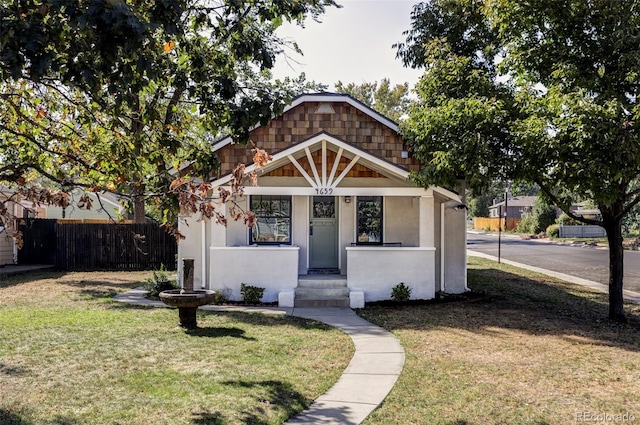 bungalow-style house with a front yard