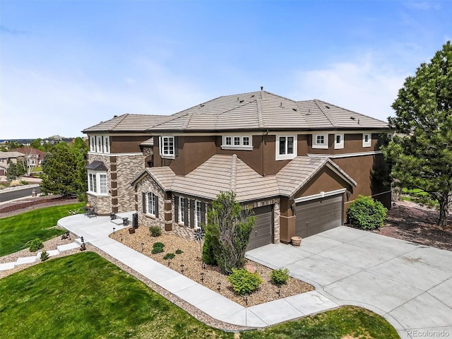 8518 High Rdg, Castle Pines, CO 80108 - view of front of home with stucco siding, stone siding, a garage, driveway, and a front lawn