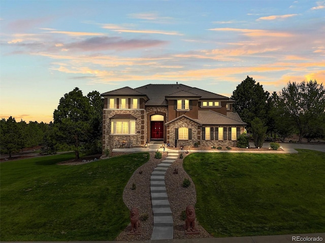 8518 High Rdg, Castle Pines, CO 80108 - view of front of home featuring stone siding and a front yard