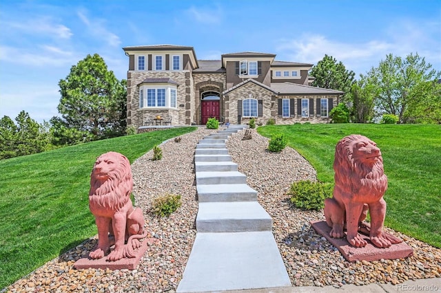8518 High Rdg, Castle Pines, CO 80108 - view of front of property with stone siding and a front lawn