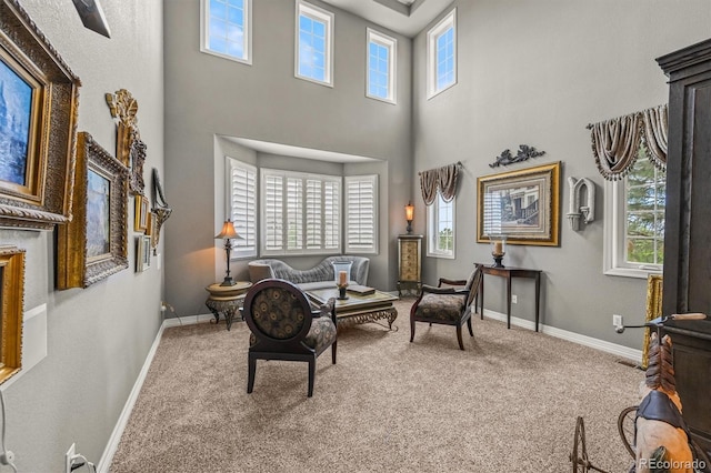 8518 High Rdg, Castle Pines, CO 80108 - living area with a high ceiling, carpet, and baseboards