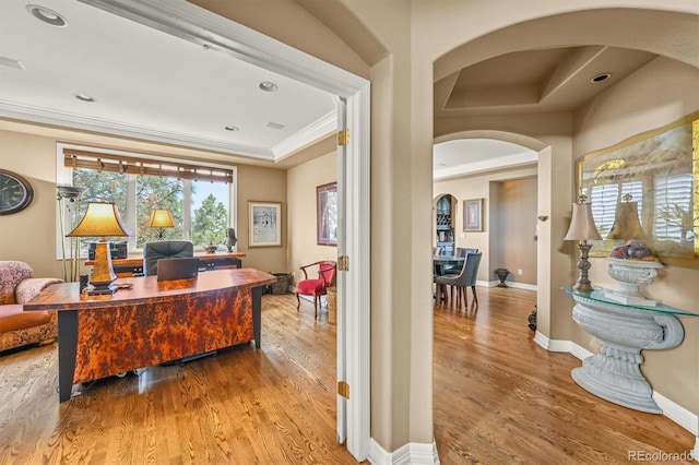 8518 High Rdg, Castle Pines, CO 80108 - home office featuring arched walkways, ornamental molding, wood finished floors, baseboards, and recessed lighting