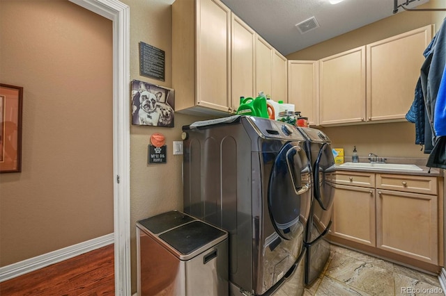 8518 High Rdg, Castle Pines, CO 80108 - laundry room featuring washing machine and clothes dryer, cabinet space, and baseboards